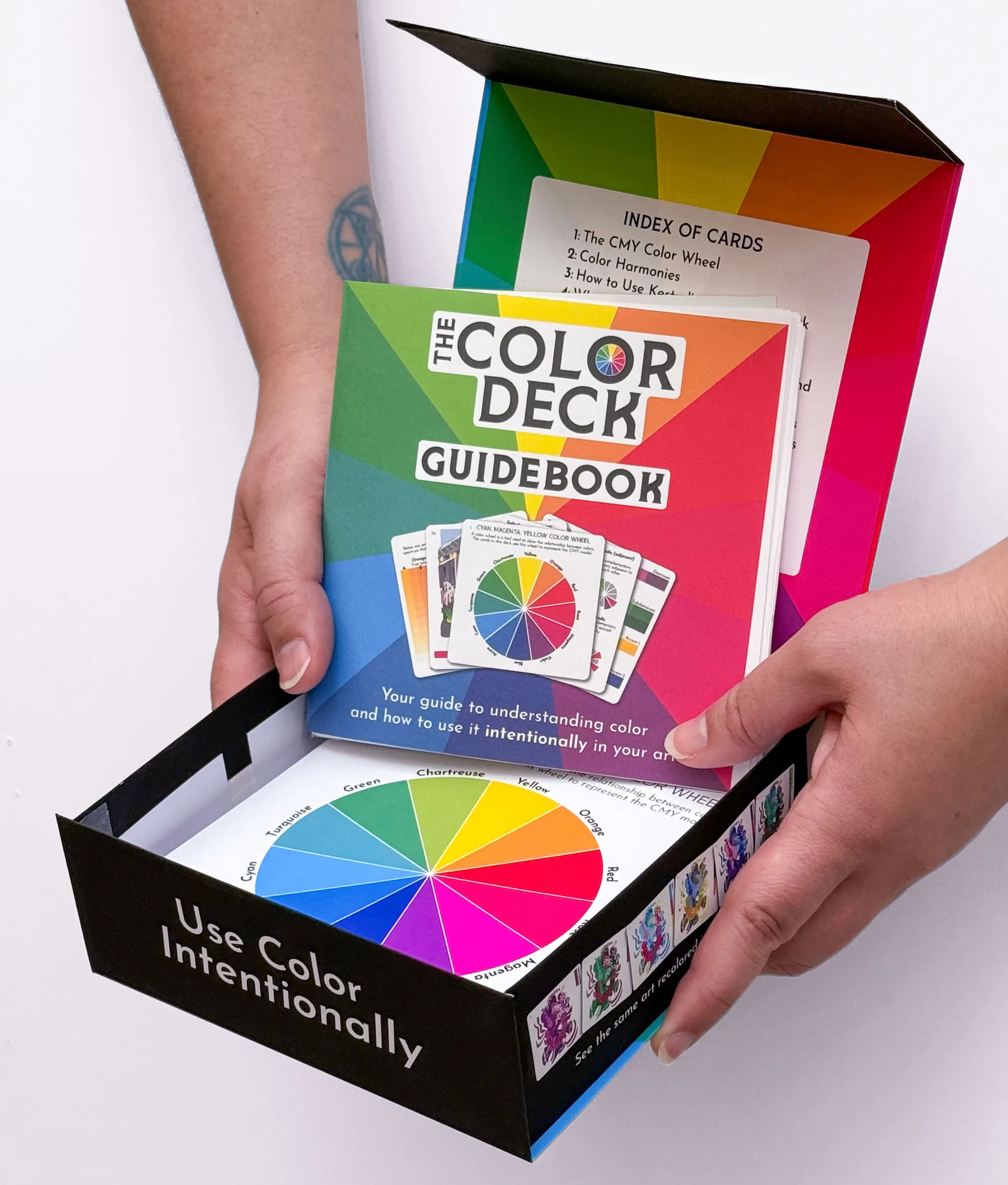 Kestrel Michaud holding a prototype of The Color Deck
